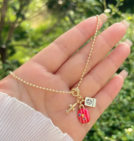 Collar maleta rosa - Baleni